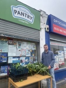 Andrew at the Pantry with some veg donations to use for cooking classes